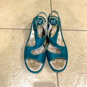 Fly London teal green sandals.